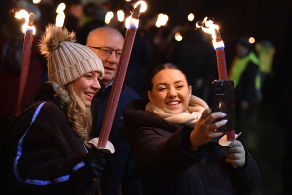 People remember loved ones in torchlit parade